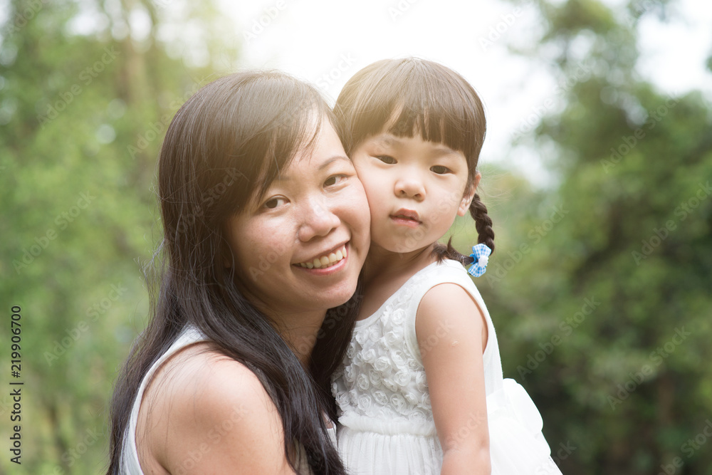 Asian mother and daughter outdoor portraits. Asian mother and daughter outdoor portraits.