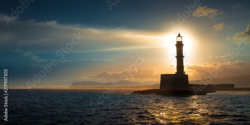 Obraz na płótnie A beautiful night sky behind a shining lighthouse. Chania, Crete, Greece w salonie
