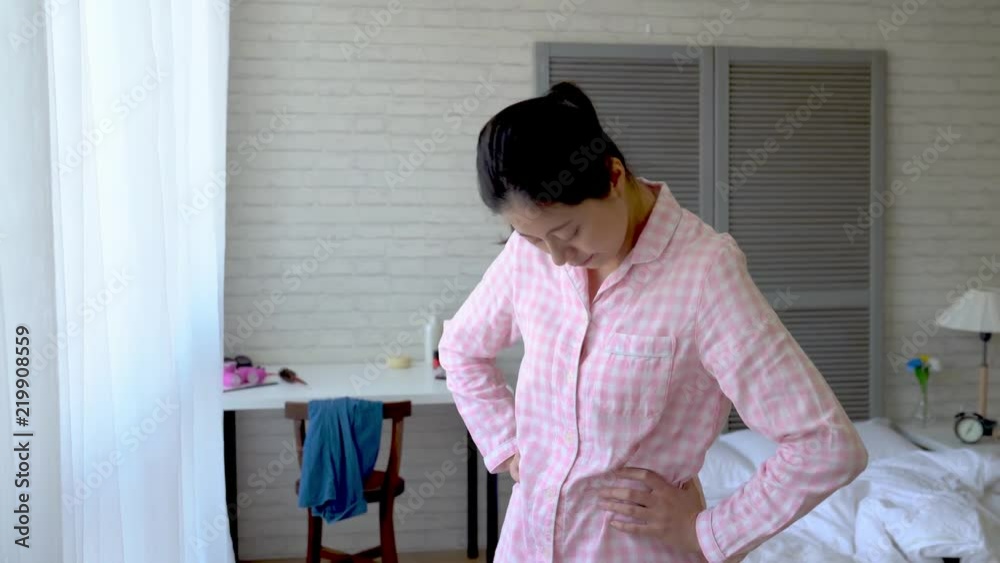 woman rotating her shoulders and neck woman rotating her shoulders and neck