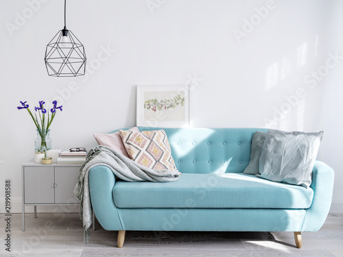 Bright blue sofa in stylish home interior photo