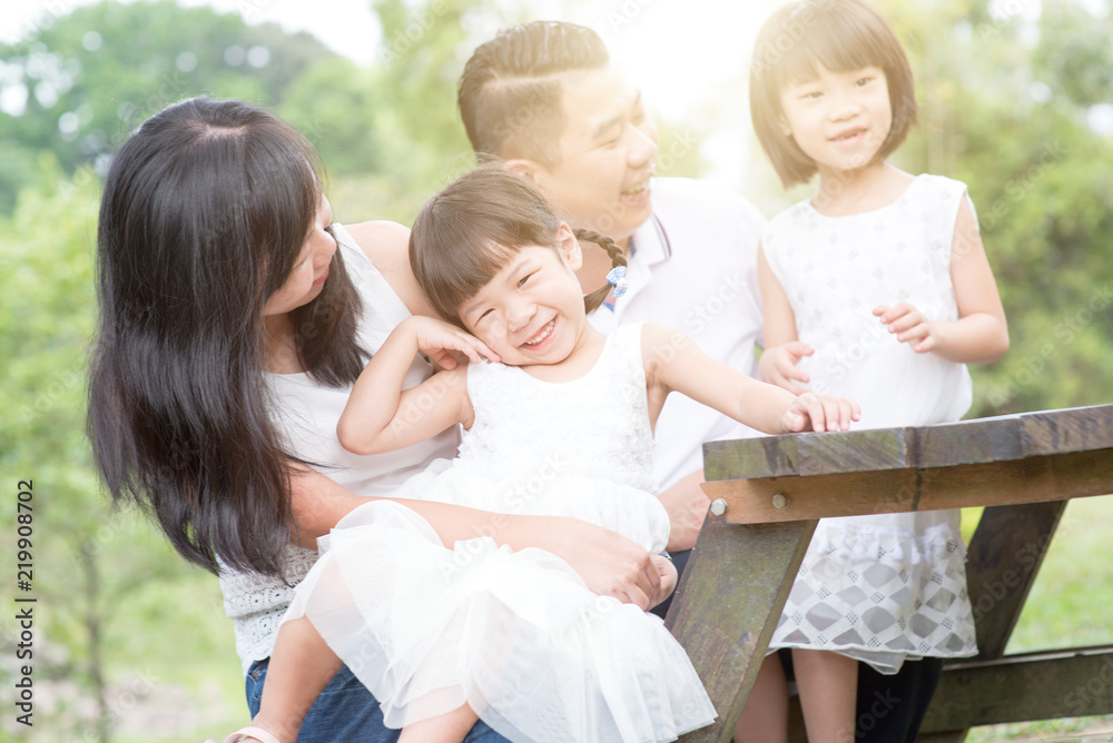 Happy Asian family bonding at outdoor with empty table Happy Asian family bonding at outdoor with empty table