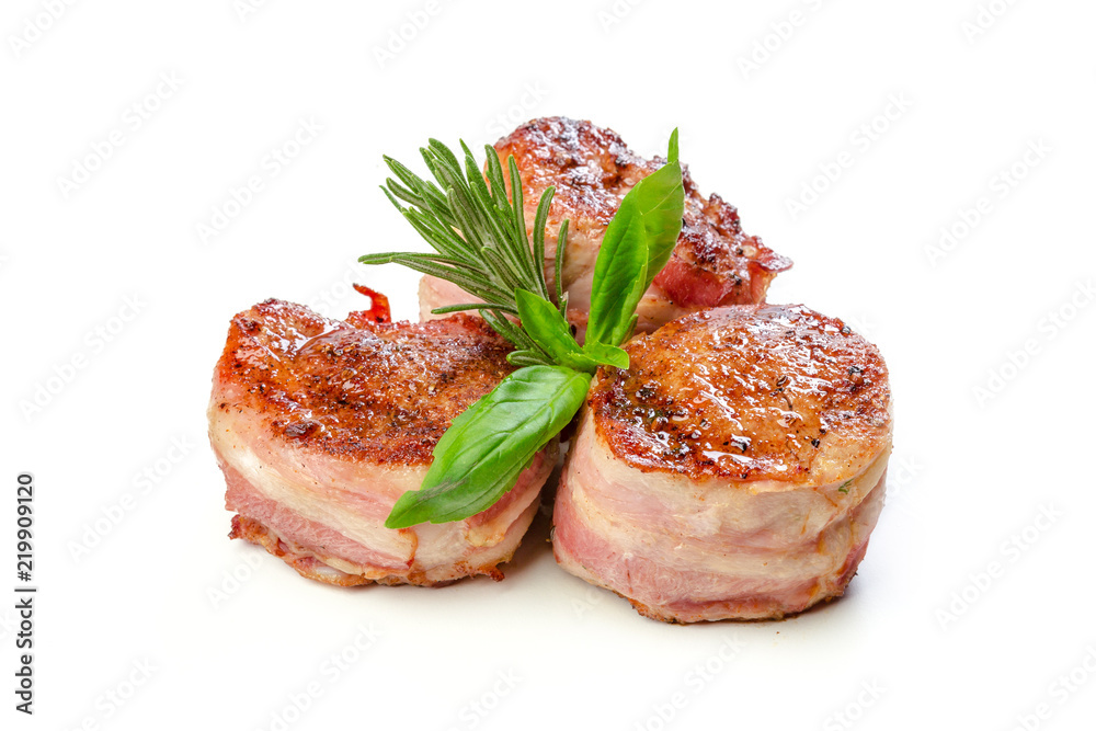 Pork fillet wrapped in bacon, isolated on white background. Pork fillet wrapped in bacon, isolated on white background.