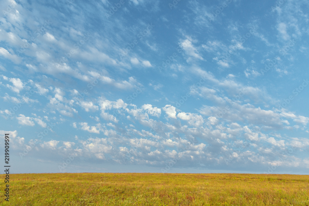 Blue sky and beautiful cloud. Plain landscape background