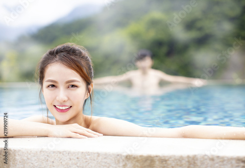 Young asian couple relaxing in hot springs