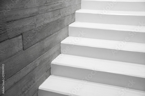 Modern reinforced concrete stairs , Concrete staircase painted in white detail, Symbol of modern minimalist living © marvlc