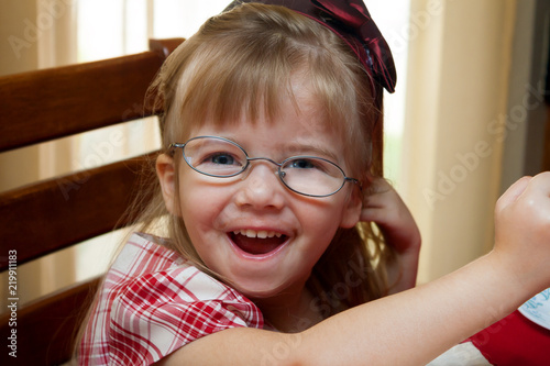 Young Girl With Thick Crooked Glasses for Strabismus