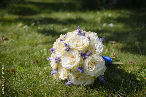Wedding bouquet on the grass  roses and lavender.