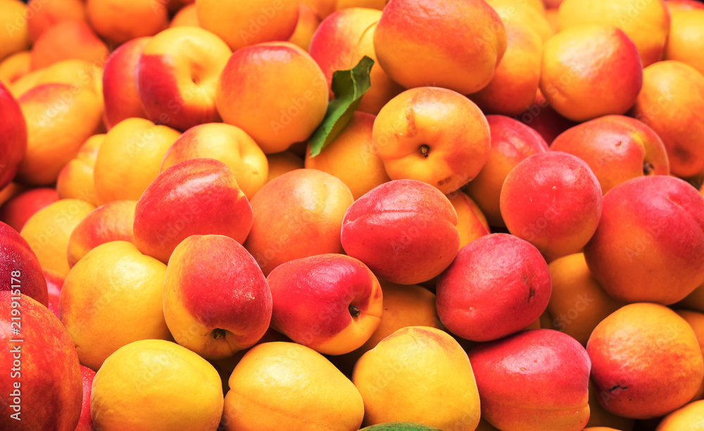 Lot of ripe nectarines in the supermarket. Lot of ripe nectarines in the supermarket.