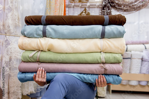 Rolls of fabric and textiles in a shop or store