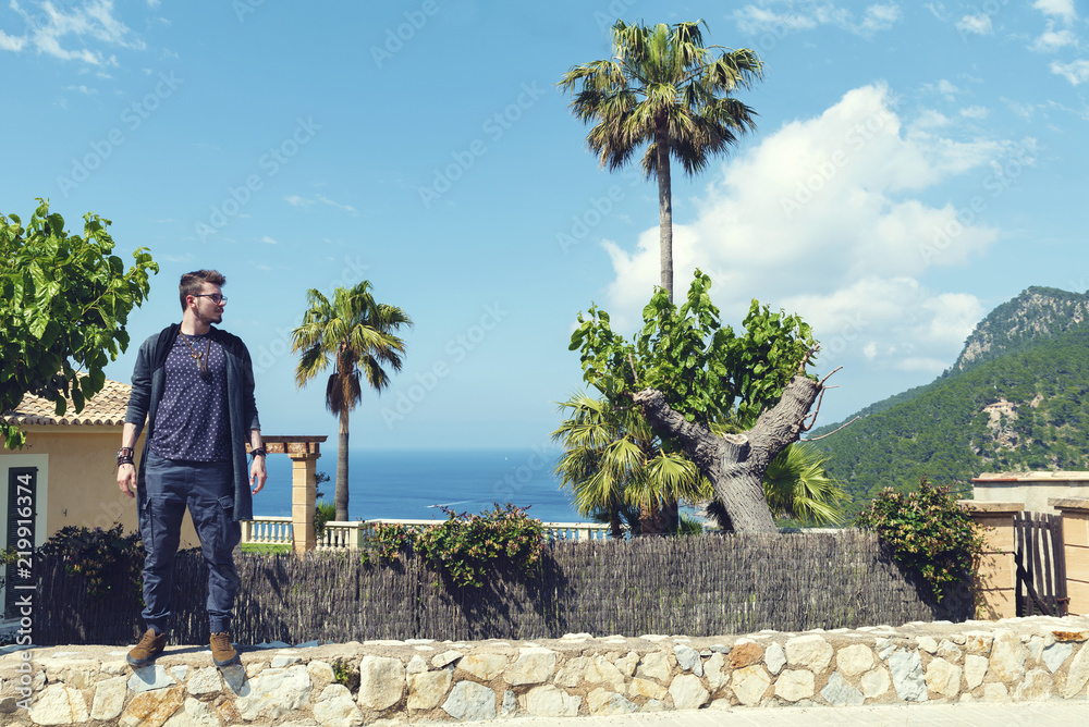 Caucasian young man in Banyalbufar Majorca Picturesque panorama