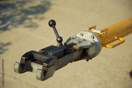 Tow bar for the plane on the asphalt background