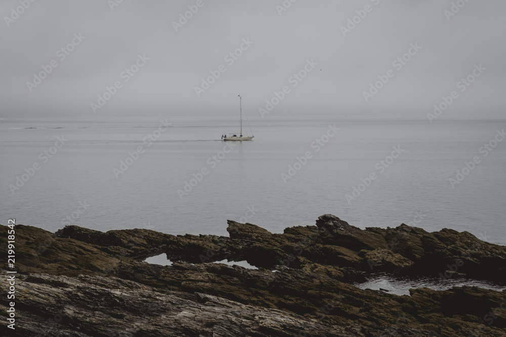 Landscape of a boat on the sea with clouds