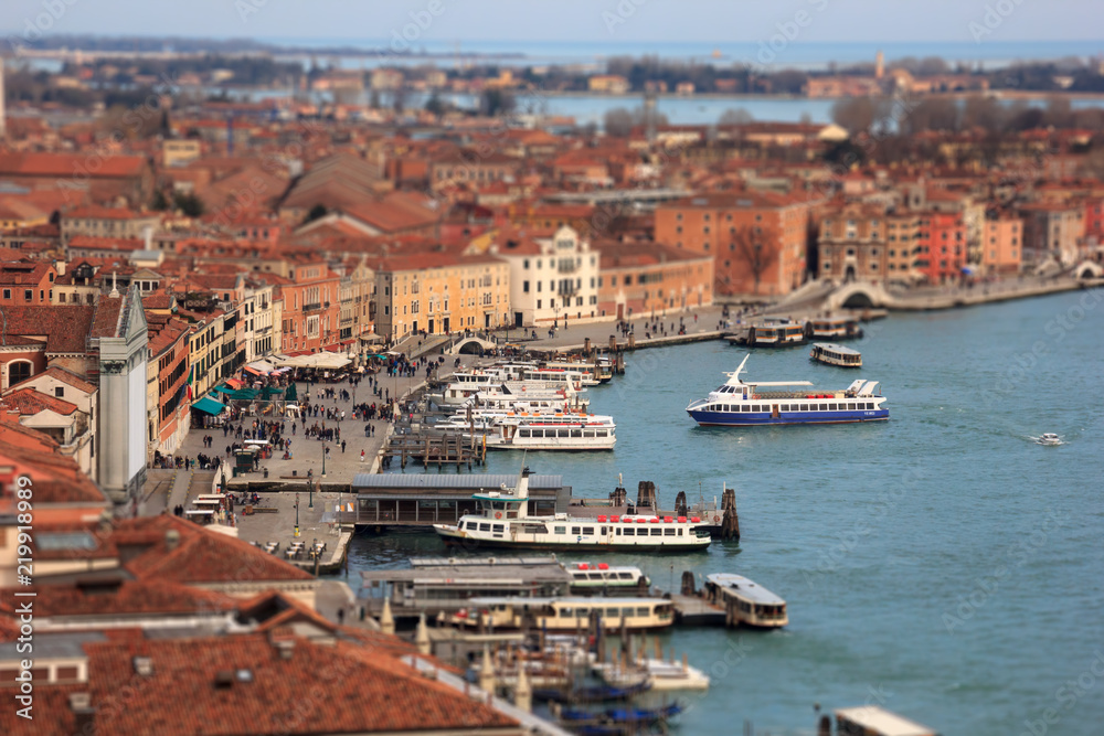 Grand Canal with boats and Basilica Santa Maria della Salute with tilt-shift effect. Venice, Italy.