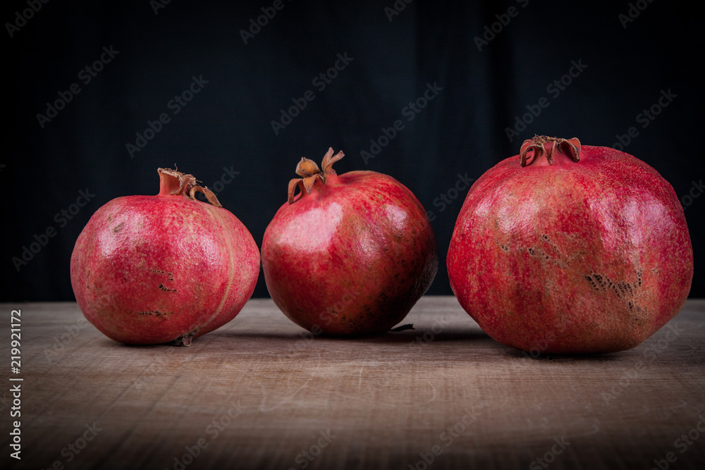 pomegranates on a black background pomegranates on a black background