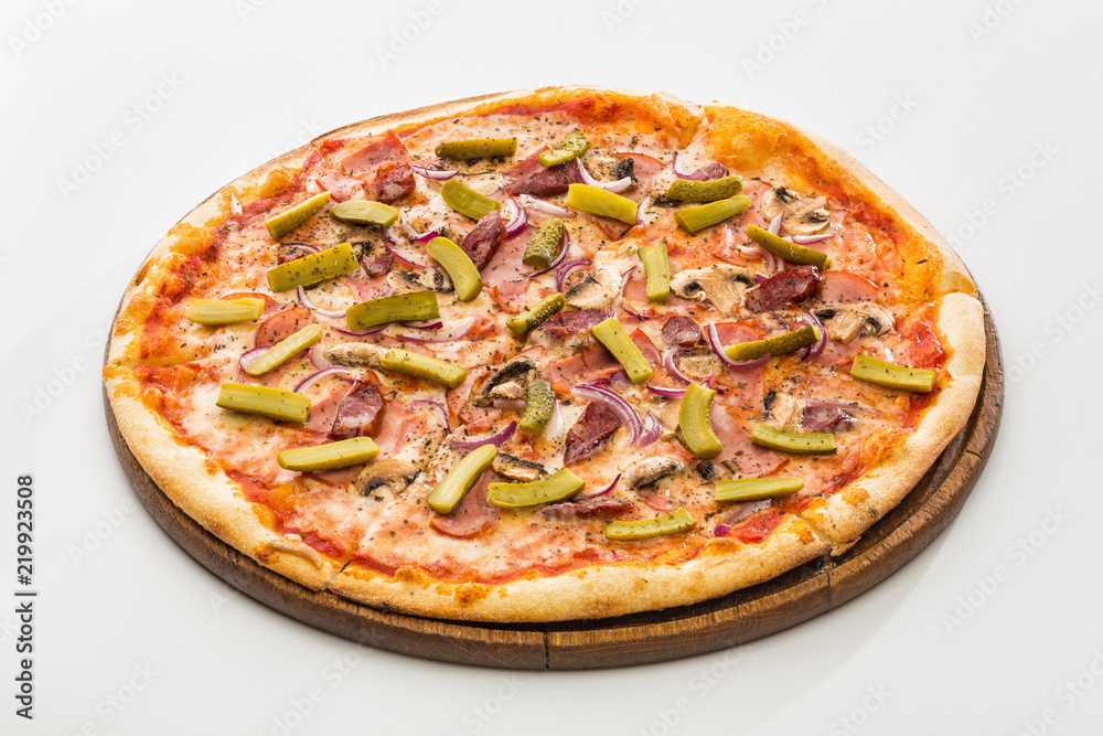 Pizza with pickled cucumbers and smoked sausages isolated on white background