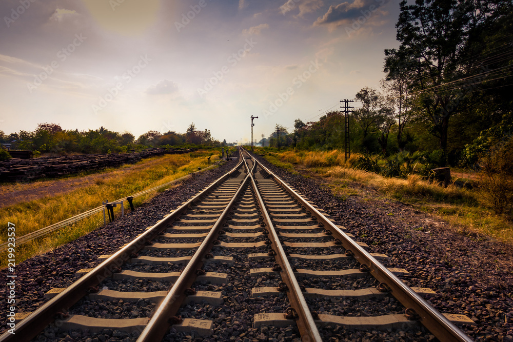 railroad or railway crossing and direct forward to future with sun and cloud blue sky railroad or railway crossing and direct forward to future with sun and cloud blue sky