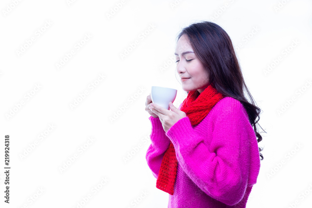 Charming beautiful woman drinks hot coffee or tea in winter season. Attractive beautiful women get nice smell of coffee or tea. Gorgeous beautiful girl hold cup of coffee. isolated white background Charming beautiful woman drinks hot coffee or tea in winter season. Attractive beautiful women get nice smell of coffee or tea. Gorgeous beautiful girl hold cup of coffee. isolated white background