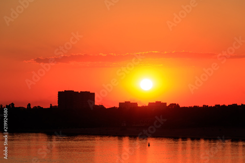 Orange sunset over a river Dnieper in Kremenchug city, Ukraine