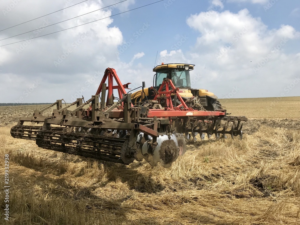 Harvester works on the field in harvesting Harvester works on the field in harvesting