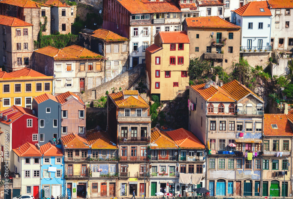 Typical houses in Porto located on a cliff, view from Vila Nova de Gaia, Porto, Portugal.