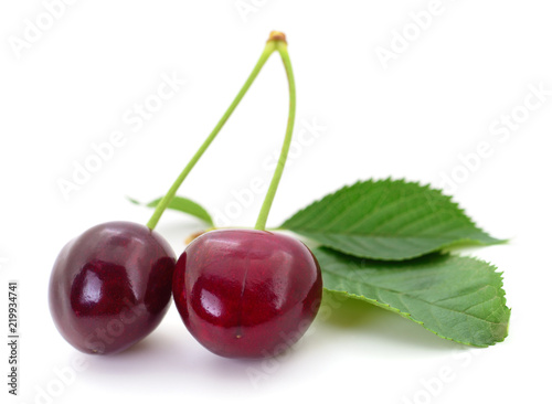 Sweet cherries with stem and leaves.