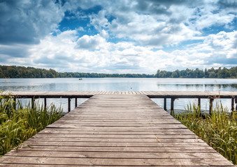 Fotobehang Pier Houten steiger Trakai zomerlandschap Litouwen  © olezzo