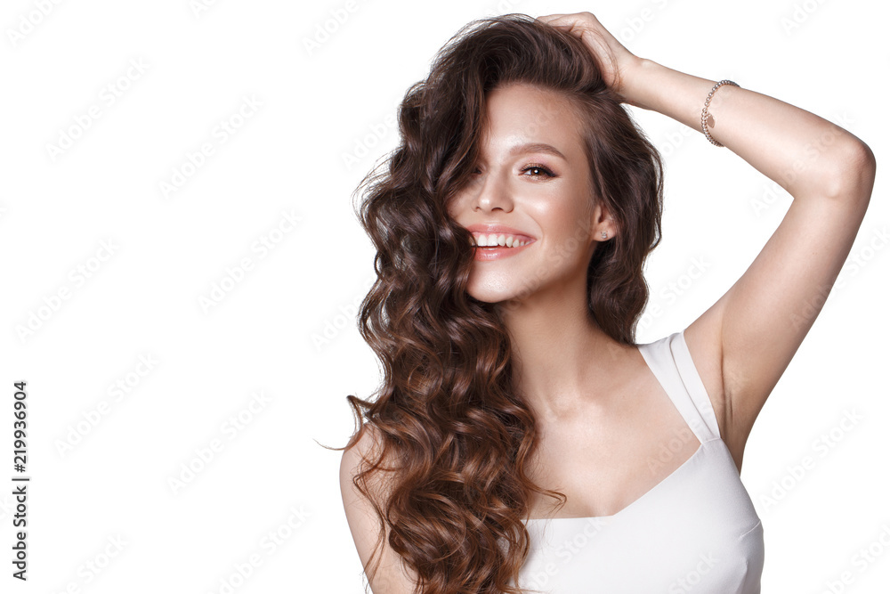 Beautiful young girl in white dress with natural make-up, hair curls and smile. Beauty face. Beautiful young girl in white dress with natural make-up, hair curls and smile. Beauty face.