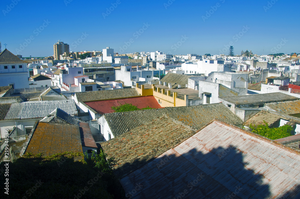 Summer city view, white houses, green ivy, Spain