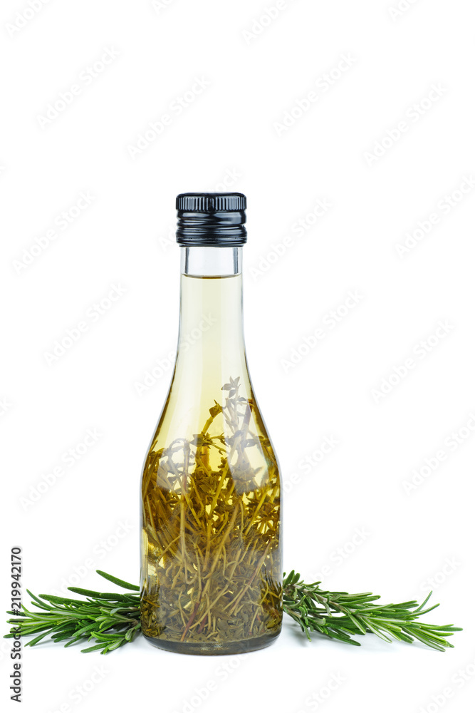 Fresh green sprigs of rosemary and apple vinegar isolated on a white background Fresh green sprigs of rosemary and apple vinegar isolated on a white background