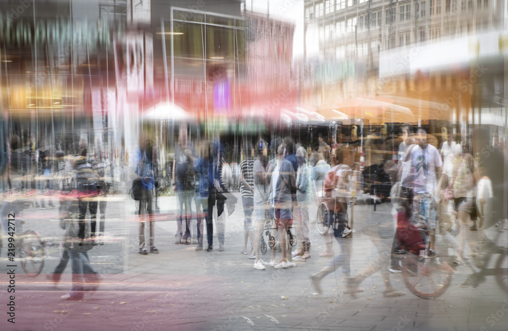 Crowd of anonymous people at a shopping mall in the big city, abstract double exposure