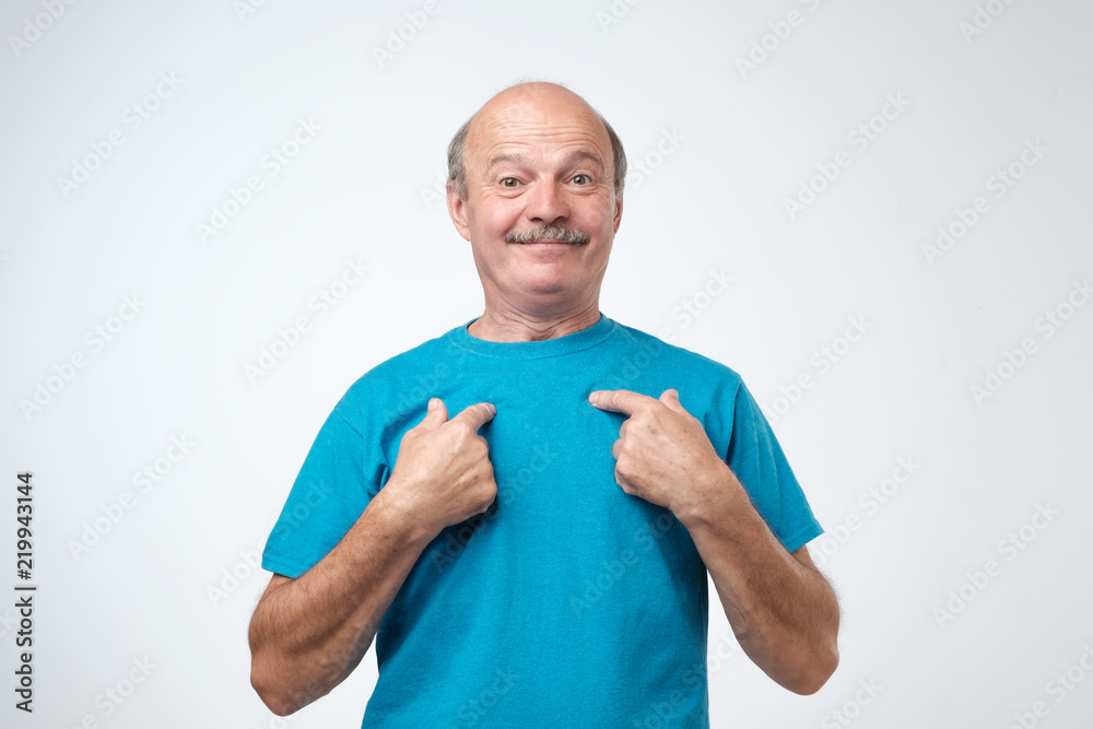 Caucasian mature man pointing to himself with question if he did something wrong. Caucasian mature man pointing to himself with question if he did something wrong.
