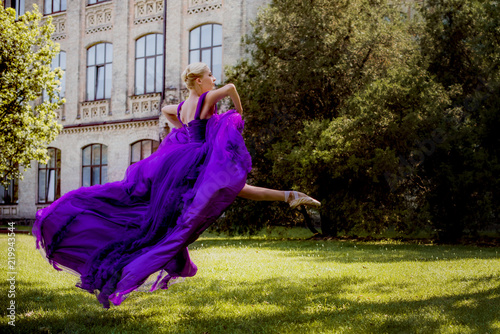 A Young Ballerina in vintage look. Ballet Dancer Girl. Image of a Dancing Woman. Lady in flying dress Dancing Jump. Classical Choreography Style 