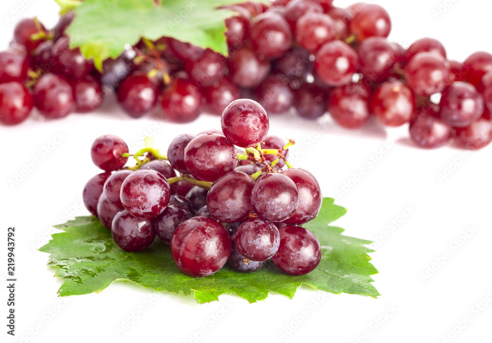 Red grape with leaf isolated on white background Red grape with leaf isolated on white background