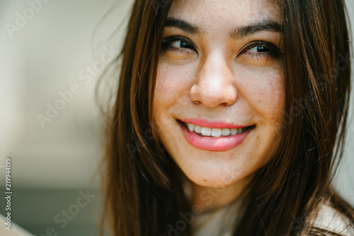 A close up photo of a young and attractive Japanese woman.