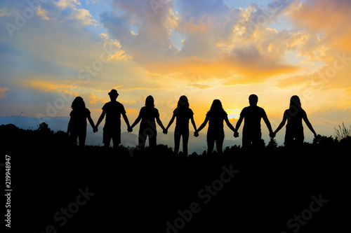 Group of people holding hands team unity