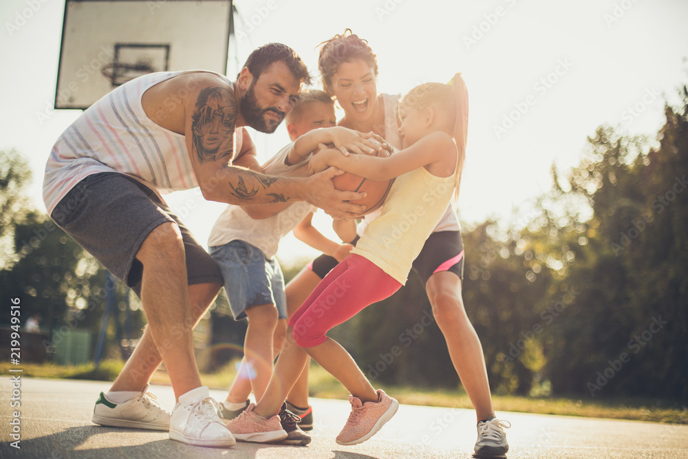 Family playing basketball outside. Family playing basketball outside.