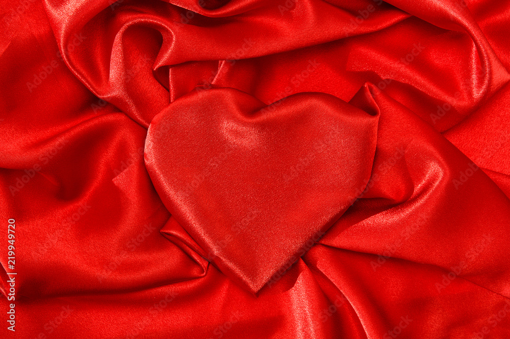 Love concept Heart shaped red silk background Love concept Heart shaped red silk background