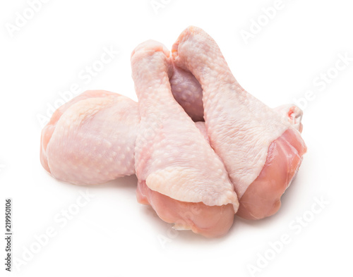 Fresh chicken legs on white background