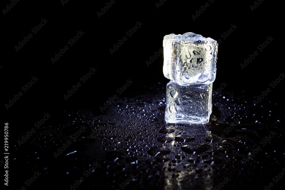 ice cubes reflection on black table background. ice cubes reflection on black table background.