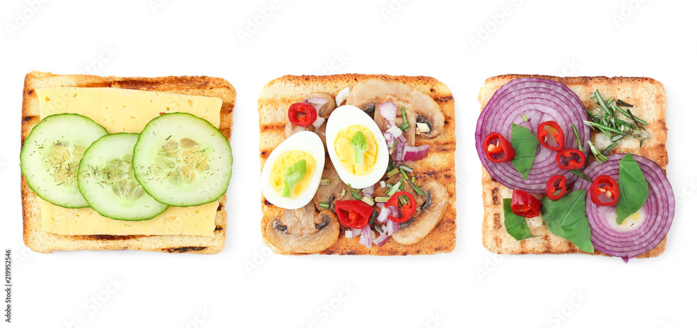 Different delicious toasts with vegetables on white background Different delicious toasts with vegetables on white background