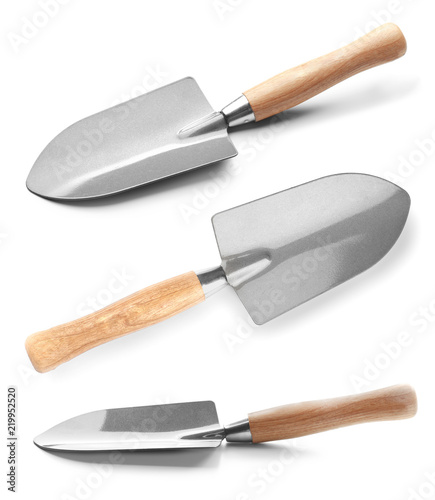 Metal shovels for gardening on white background