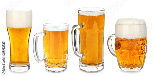 Different glassware with fresh beer on white background