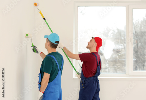 Male painters in uniform wo...