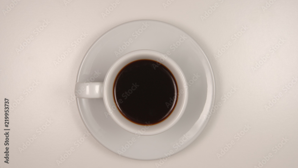 TOP VIEW: Dark coffee in a white coffee cup