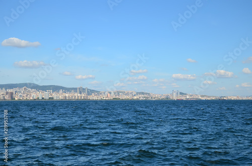 View to Istanbul from Prince's Islands (Büyükada). Sea cityscape with modern skyscrapers of Istanbul. Beautiful blue sky with white clouds © Iryna
