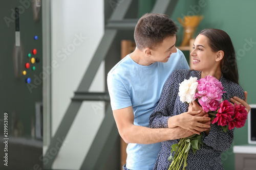 Young man giving beautiful ...