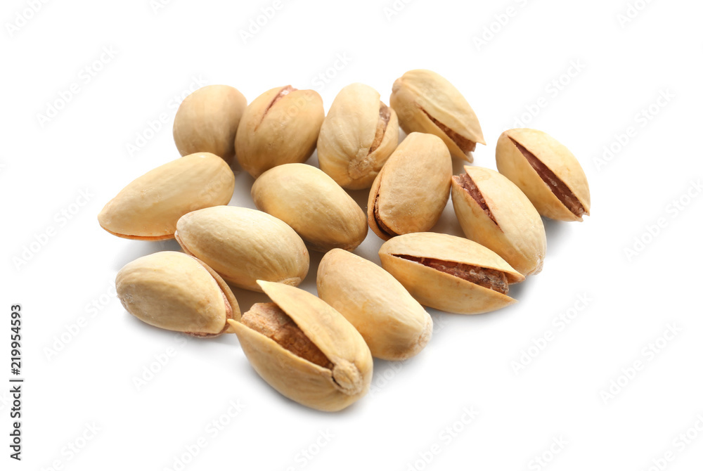 Tasty pistachio nuts on white background