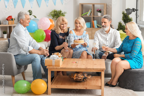 Mature people celebrating b...
