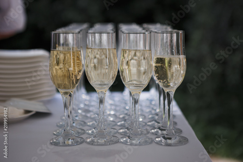 wedding ceremony outdoors, champagne glasses on the table
