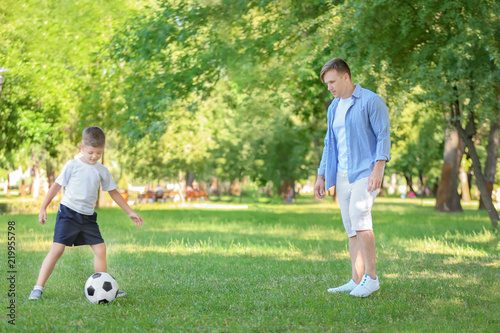 Little boy with his dad pla...